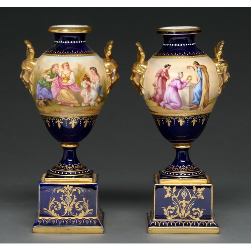 464 - A pair of Vienna style cobalt ground vases, early 20th c, of pear shape with gilt female mask handle... 