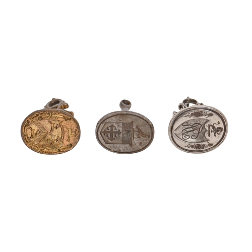 519 - Three English steel watch fob seals, late 18th c, one gilt, engraved with shields of arms or monogra... 