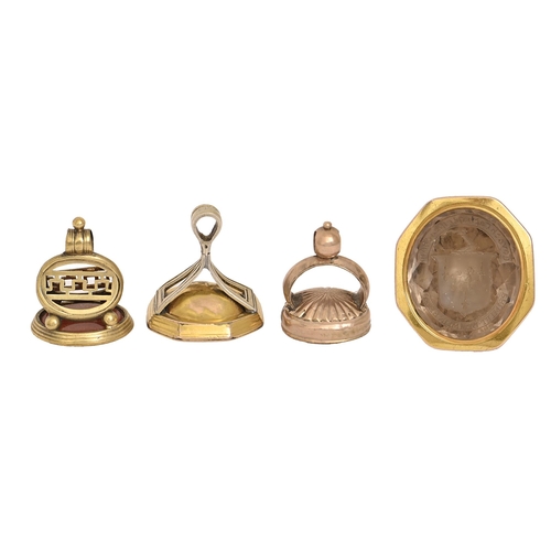 522 - Three English giltmetal watch fob seals, early 19th c, comprising  a George III giltmetal seal,... 