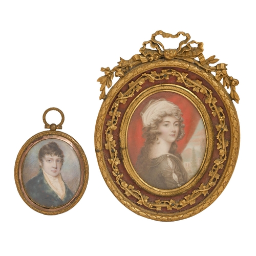 544 - 19th century School - Portrait miniature of a young Man, in a blue coat, ivory, 57mm, in brass frame... 