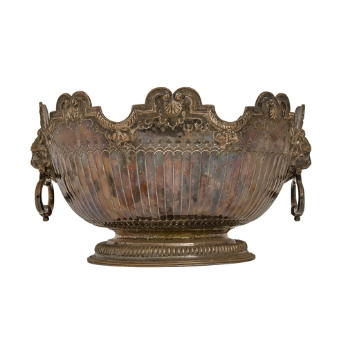 557 - A Queen Anne silver punch bowl, with lion mask and ring handles, the partly gadrooned, undulating ri... 