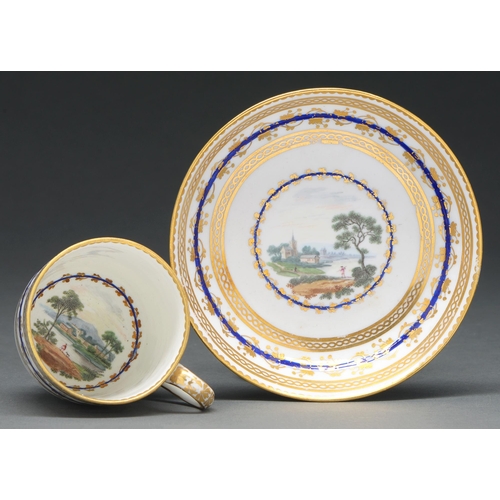 612 - A Derby coffee cup and saucer, c 1781, painted by Zachariah Boreman with two picturesque landscapes,... 