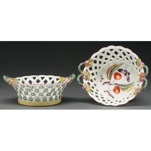 628 - A pair of early Derby reticulated baskets, c 1758, with twin green entwined loop handles issuing fro... 