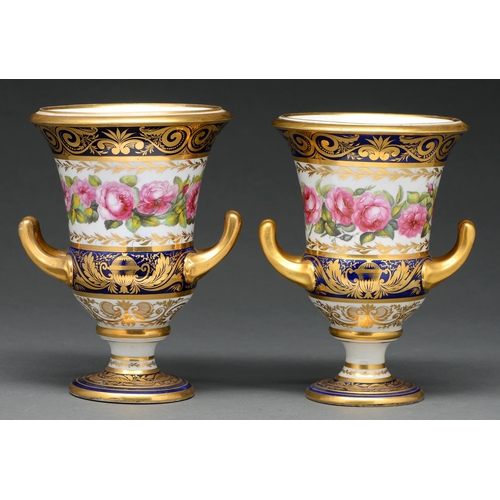 648 - A pair of Derby vases, c 1820, of campana shape with gilt loop handles, painted with a continuous ba... 