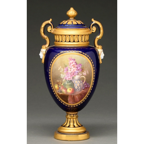 685 - A Royal Worcester vase and cover, 1913, shield shaped with mask handles, painted by W A Hawkins... 