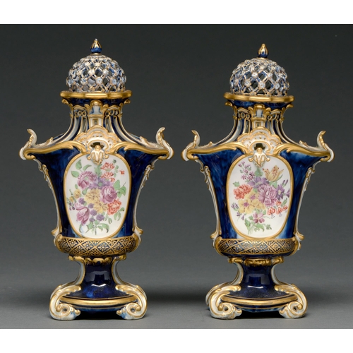 702 - A pair of Chelsea pot pourri vases and covers, Gold Anchor period, c 1765-69, painted with oval meda... 