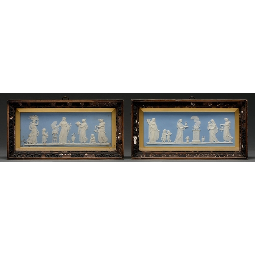 703 - A pair of Wedgwood blue jasper tablets, early 19th c, sprigged with classical figures including a wo... 