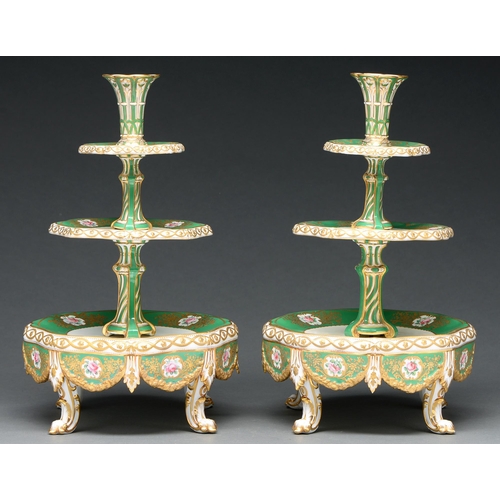 717 - A pair of French porcelain three tier fruit and flower stands, c 1840, the apple green border painte... 