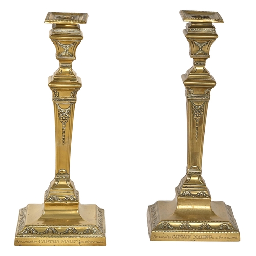 757 - A pair of Victorian brass candlesticks, in neoclassical style, the base inscribed Presented to Capta... 