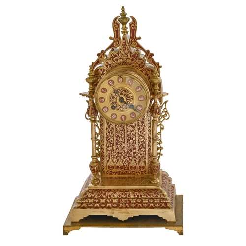 767 - A French Troubadour style gilt brass and red enamel mantle clock, late 19th c, with gong striking mo... 