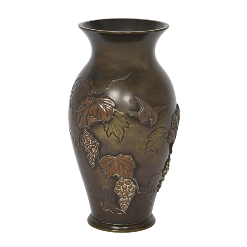 768 - A Japanese bronze baluster vase, Meiji period, carved and applied with birds and grapes, 19cm h... 