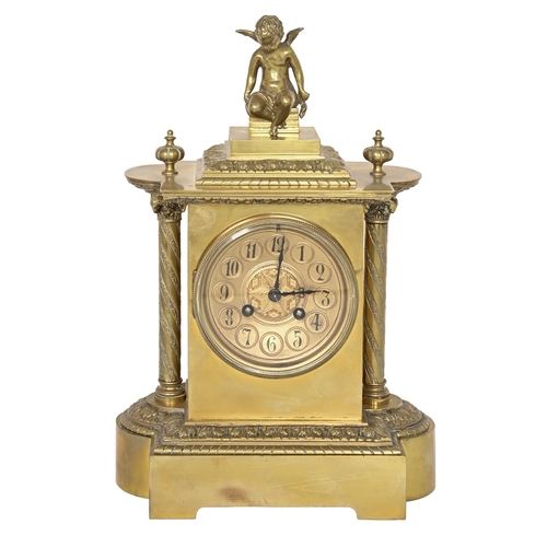 769 - A French gilt brass mantle clock, late 19th c, the pillar shaped casing surmounted by the seated fig... 