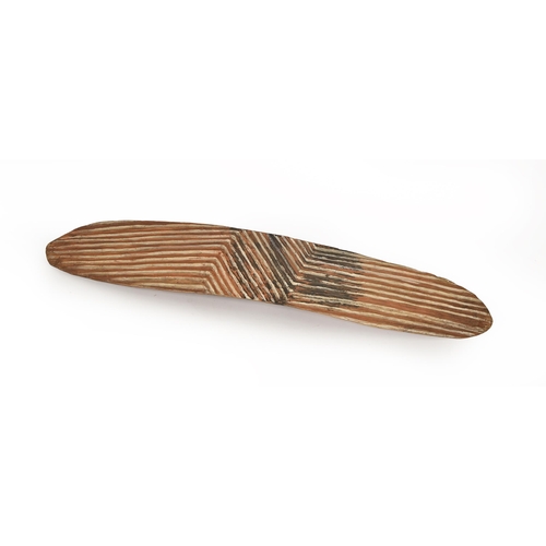 778 - Tribal art. Australia. An Aboriginal wood shield, Wunda, 20th c, with pigment decoration, 70 x 12cm... 