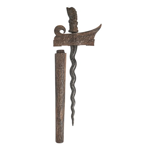 779 - Edged weapon. A carved wood kris, Bali, 20th c, overall length 58cm