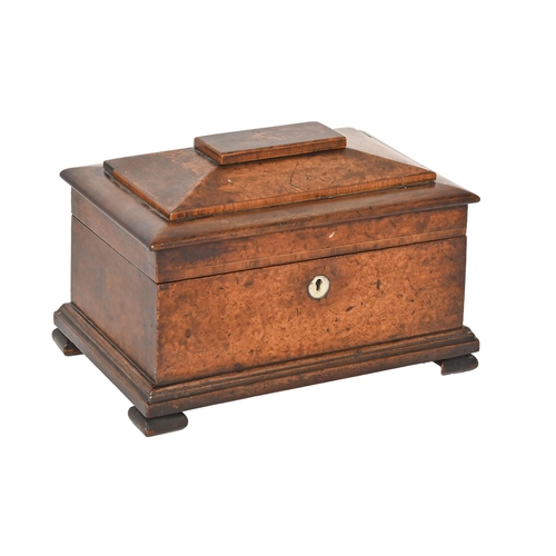 783 - An early Victorian burr yew wood and mahogany tea caddy, of sarcophagus shape, the lid with sliding ... 