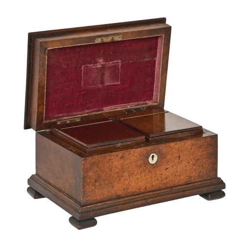 783 - An early Victorian burr yew wood and mahogany tea caddy, of sarcophagus shape, the lid with sliding ... 