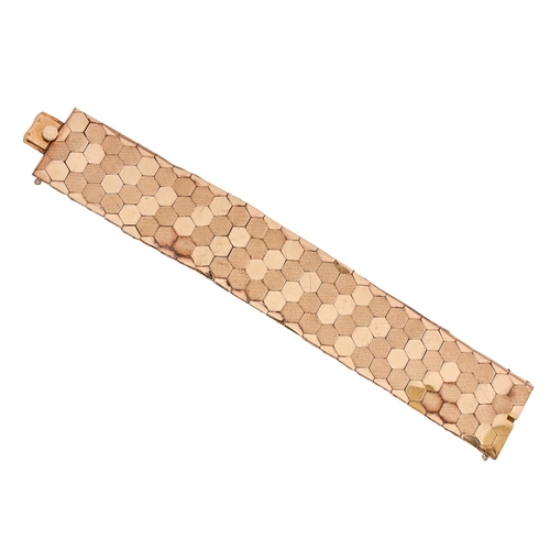 79 - A gold bracelet, of matt and polished gold hexagons, 19cm l, foreign control marks, 75.2g... 