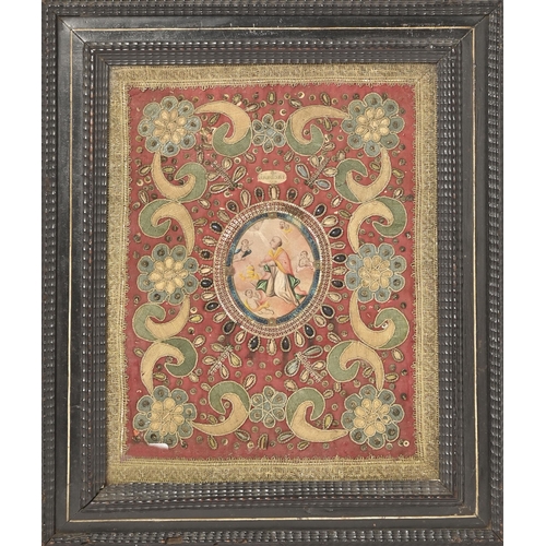 834 - An embroidered textile book cover, 17th c, centred by a vellum oval reserve painted in polychrome wi... 