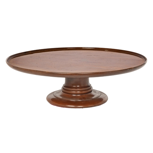 841 - A Victorian mahogany lazy susan, the dished top rotating on substantial turned foot, 17.5cm h; 55.5c... 