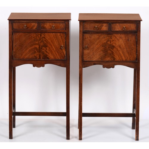 1058 - A pair of mahogany pot cupboards, early 20th c, in figured veneers and fitted with two drawers, 80cm... 