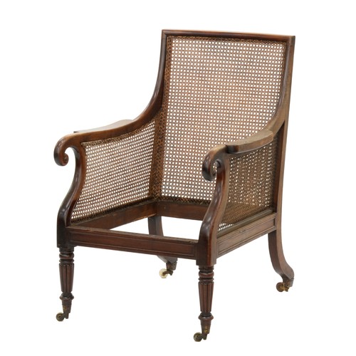 1204 - An Edwardian mahogany armchair, 92cm h, a William IV mahogany bergère, with caned back and sides, ov... 