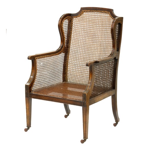 1204 - An Edwardian mahogany armchair, 92cm h, a William IV mahogany bergère, with caned back and sides, ov... 