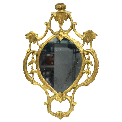 1054 - A George III rococo giltwood mirror, c1770, carved with 'C' scrolls and cascades, crested by a flowe... 