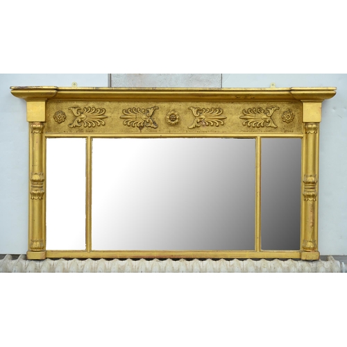 1055 - An early Victorian giltwood overmantle mirror, the sanded frieze applied with palmettes and rosettes... 