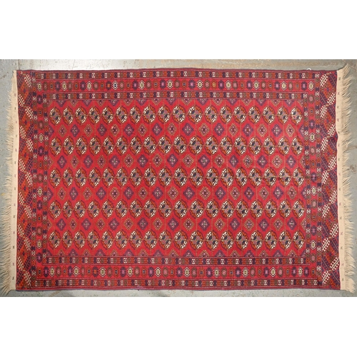 1065 - A Middle Eastern rug, 255 x 174cm