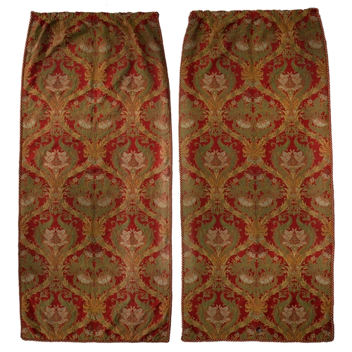 1092 - A pair of arts and crafts crimson ground damask and braided curtains, in the manner of Morton Sundou... 