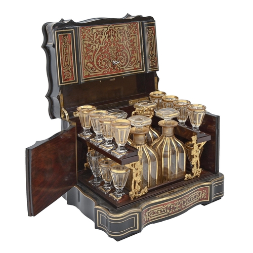 1098 - A French ebonised and Boulle decanter case, late 19th c, inlaid with cut brass scrollwork on a groun... 