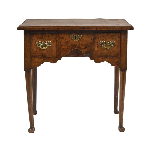 1109 - A George III walnut lowboy, with quarter veneer top and round tapering legs, 77cm h; 77 x 46cm... 