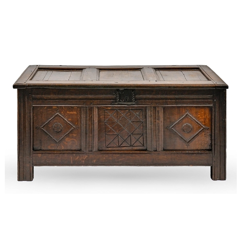 1129 - A George III carved and panelled oak blanket chest, 56cm h; 117 x 53cm