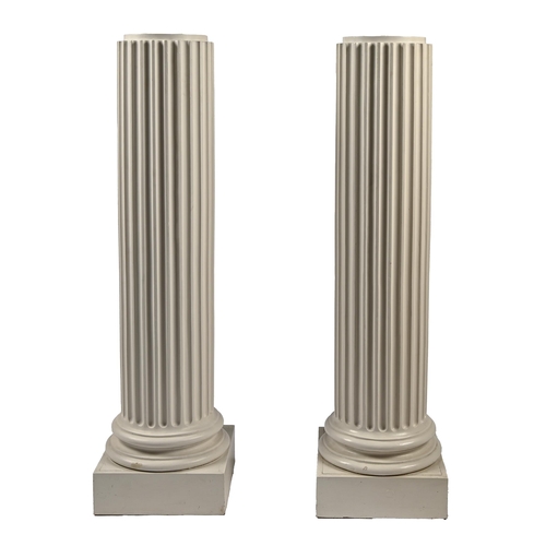 1143 - A pair of painted plaster statuary pedestals, first half 20th c, the fluted shaft on Attic base and ... 