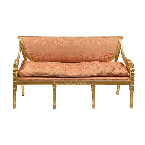 1153 - A French giltwood settee, late 19th/early 20th c, in Empire style, with winged demi-figure arms, on ... 