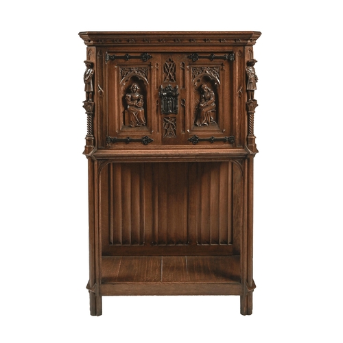 1164 - A North European antique style carved oak cupboard, the upper part enclosed by doors, inset with and... 