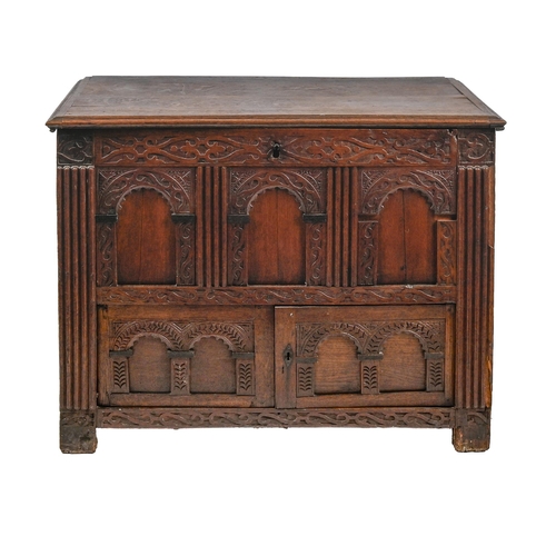 1165 - A carved oak Lancashire chest, 18th c, the front decorated with carved arched top panels, carved fri... 