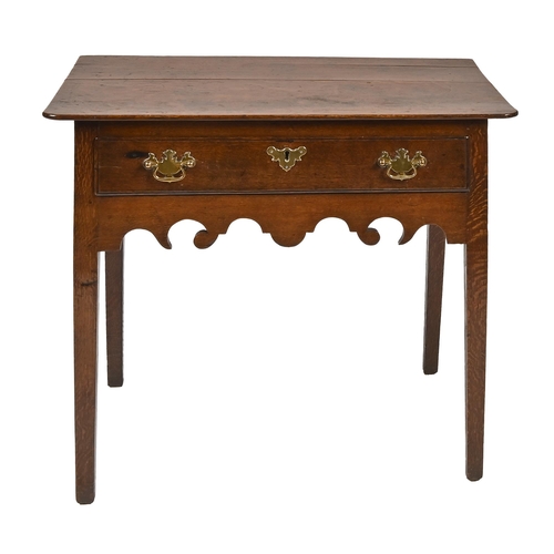 1174 - A George III oak lowboy, with boarded top on square tapering legs, 70cm h; 79 x 48cm... 