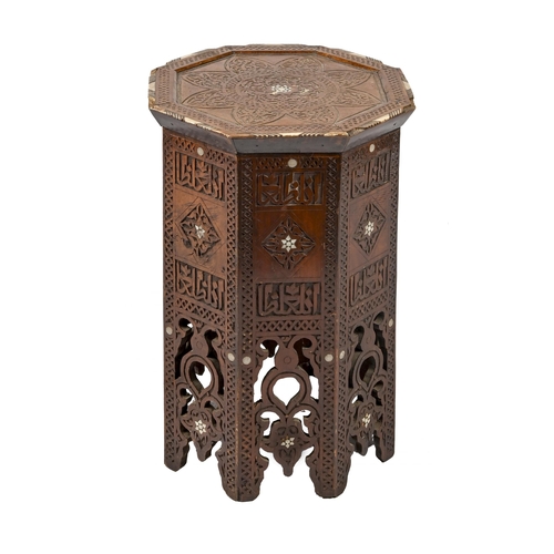 1175 - A Middle Eastern carved hardwood octagonal occasional table, early 20th c, inlaid with bone and moth... 