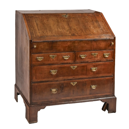 1192 - A George II walnut and feather-banded bureau, with stepped interior with well, the flap in matched v... 