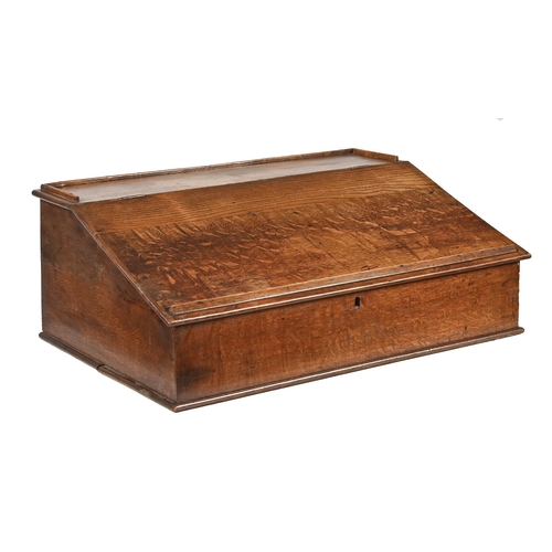 1199 - An oak desk top writing box, early 19th c, with hinged sloping lid and fitted interior, 26cm h... 