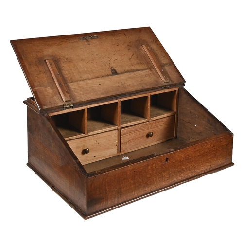 1199 - An oak desk top writing box, early 19th c, with hinged sloping lid and fitted interior, 26cm h... 