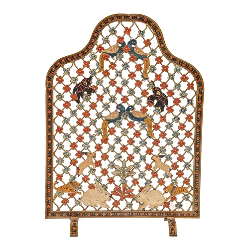 1237 - A polychrome sheet metal and wire mesh firescreen, second quarter 20th c, with fanciful birds and an... 