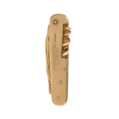 197 - A rare entirely 9ct gold multitool folding knife, with engine turned scales, the tools comprising fr... 