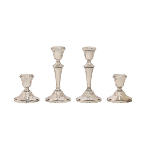 201 - Two pairs of Elizabeth II silver candlesticks,  14.5cm and shorter, by William Adams Ltd, Birmi... 