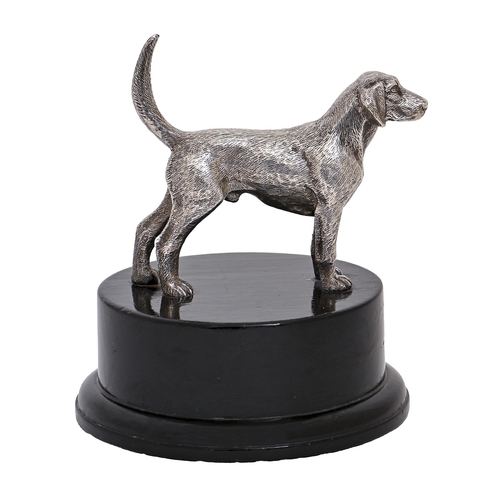 208 - An Elizabeth II cast silver sculpture of a foxhound, on ebonised base, the silver tablet engraved wi... 