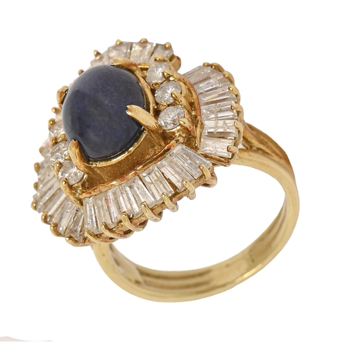 46 - A sapphire and diamond ring, the central sapphire en cabochon flanked by six round brilliant cut dia... 