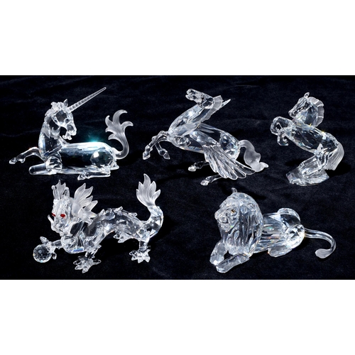 522 - Swarovski. Four large glass models of Pegasus, unicorn, lion and dragon, boxed