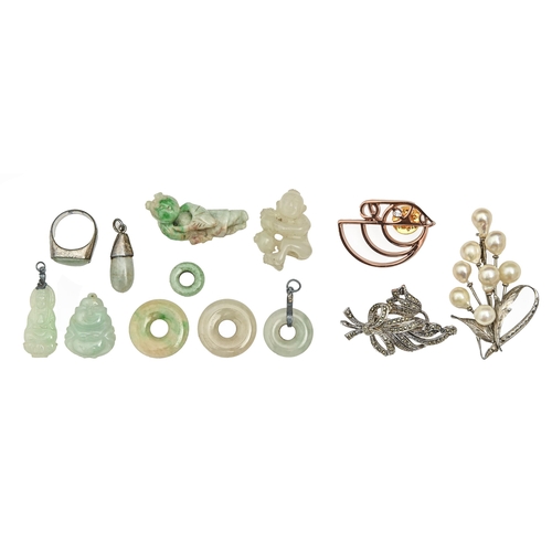 571 - Miscellaneous Chinese jade jewellery, early 20th c and later, including pendants, rings and miniatur... 