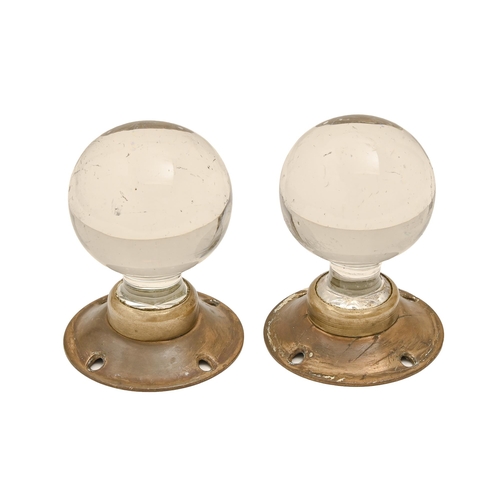 574 - Two glass and brass spherical doorknobs, 1930s, 75mm l